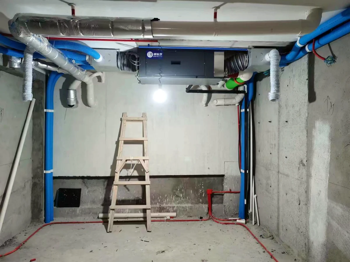 Fresh air dehumidifier installed above a mechanical room and connected to ducts